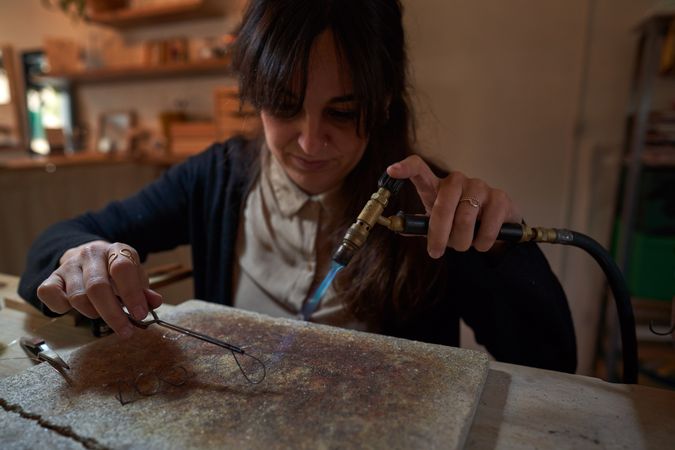 Professional artisan making detail with gas burner