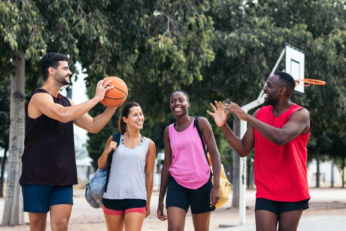 Group of friends on their way to play basketball