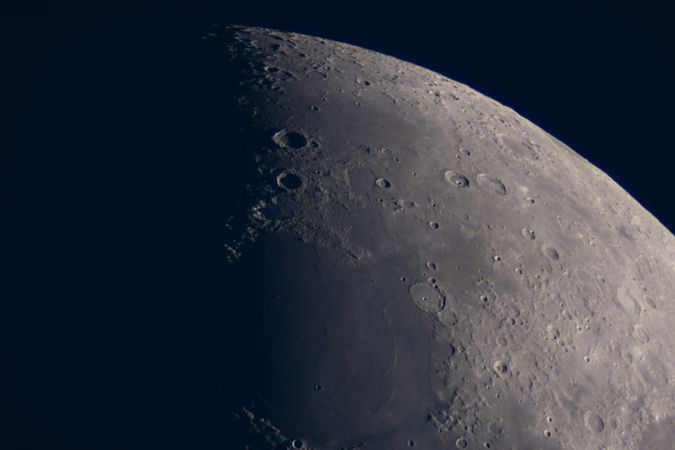 Crescent Moon captured during night showing textured lunar surface