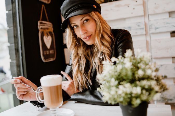 Woman drinking coffee from a glass