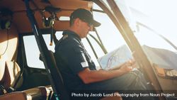 Helicopter pilot reading air map on while grounded 5arPQ4