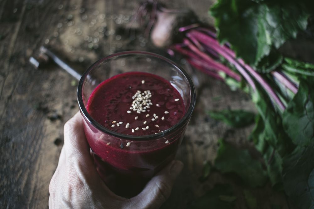 Beetroot and fresh smoothie on wooden table