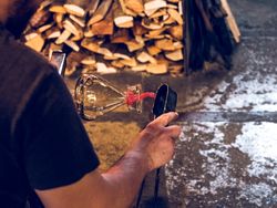 Anonymous glassblower making vase in workshop