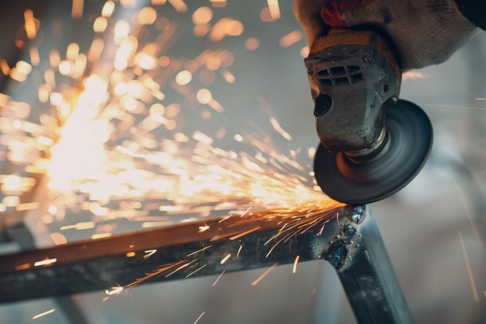 Cropped image of a hand welding a frame in close-up
