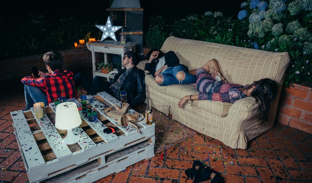 Group of friends lounging around after a fun party