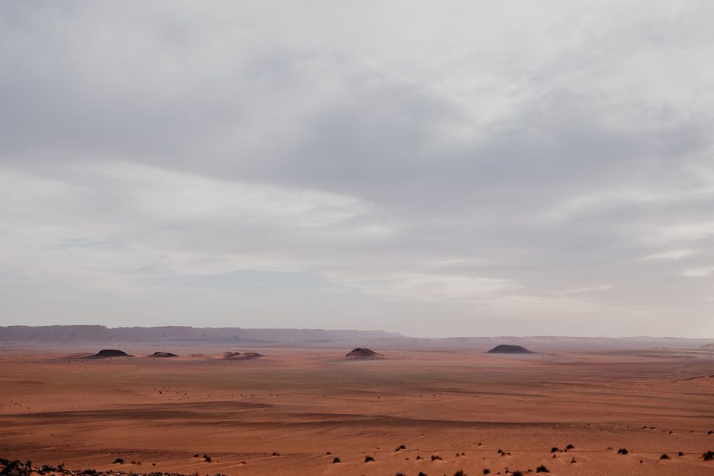 Sunset sky over hills in desert