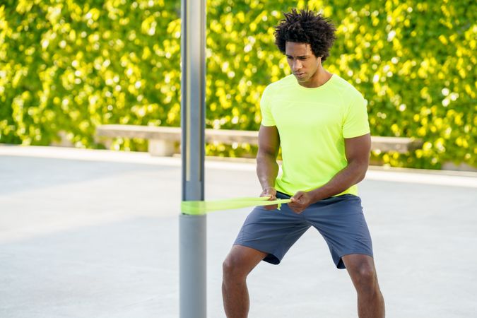 Man concentrating on resistance band workout