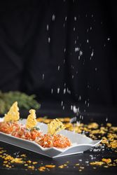 Tasty Quenelles of tomato fondue and Parmensan tile in ornamental plate