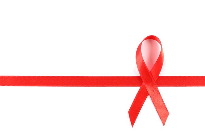 Red awareness ribbon isolated on blank background