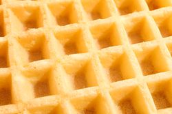 Belgian waffles texture as background, closeup