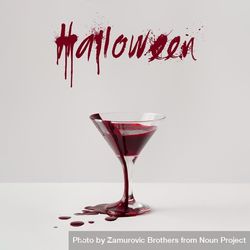 Martini glass full of blood with “Halloween” text 0LamP5