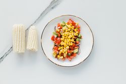 Served corn tomatoes and zucchini