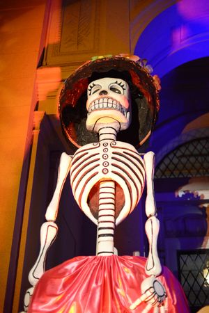 Tall Day of the Dead sculpture of woman with hat and skirt