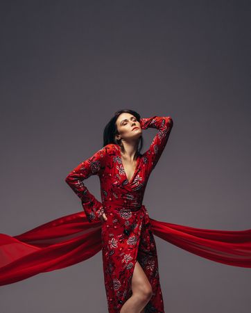 Sensual woman posing in red dress