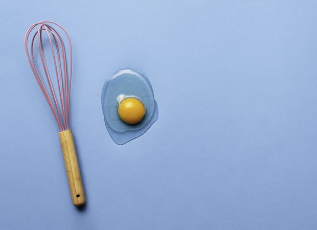 Pink whisk with raw egg