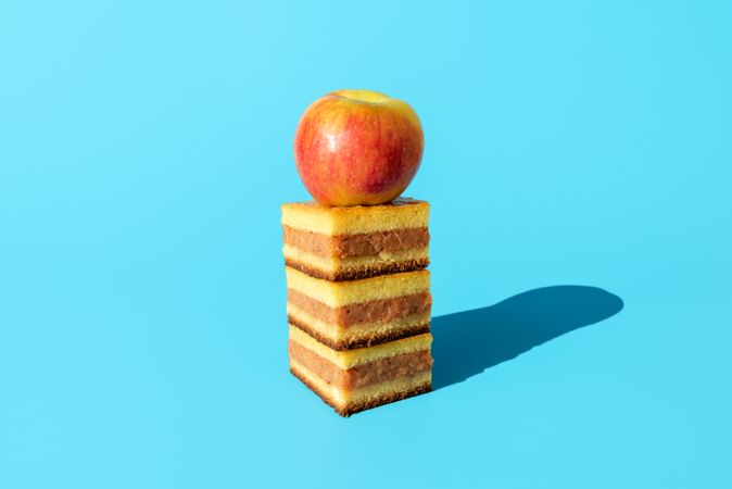 Homemade apple cake portions minimalist on a blue background
