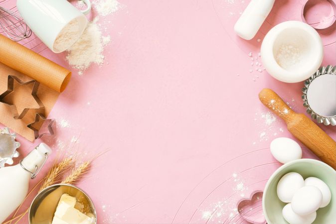 Pink background with raw ingredients for baking