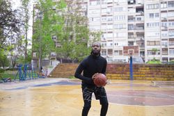 Young Black Man Playing Basketball.