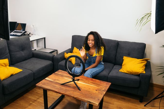 Young woman vlogging for social media
