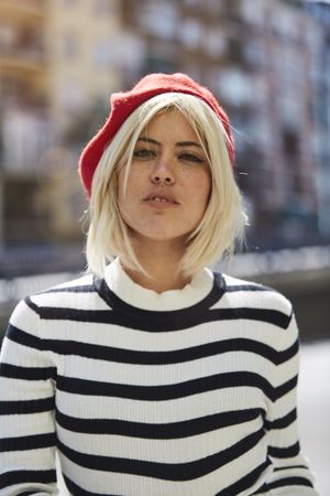 female in red beret outdoors