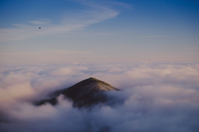 Wonderful view of blue sky above thick clouds in valley from mountain