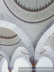 Arches meeting at the ceiling in a mosque 0VelOb