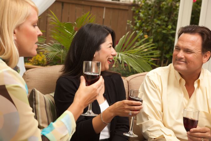 Three Friends Enjoying Wine on the Patio