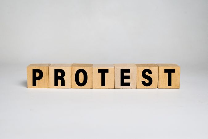 protest word text on wooden blocks