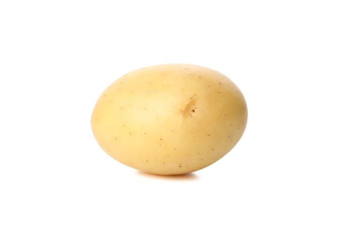 Whole potato in bright room