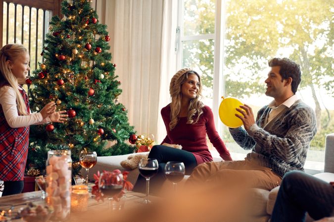 Young family having fun at home during christmas