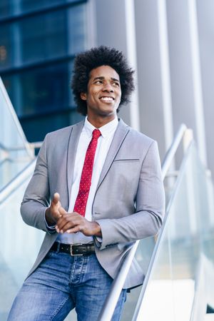 Happy man in business casual on stairs