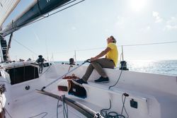Sailor looking up while navigating on boat