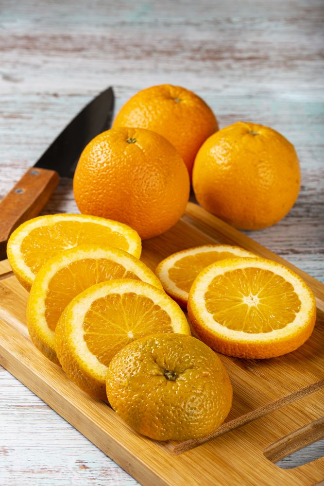 Sliced oranges on the table.