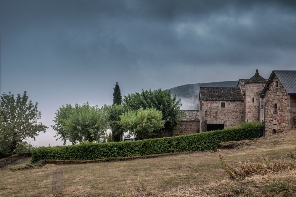 Traditional stone house in French village on over cast day