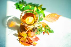 Top view of autumnal tea with lemon