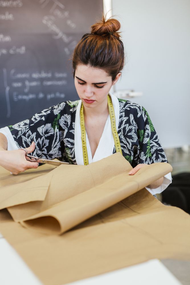 Woman in a sewing school