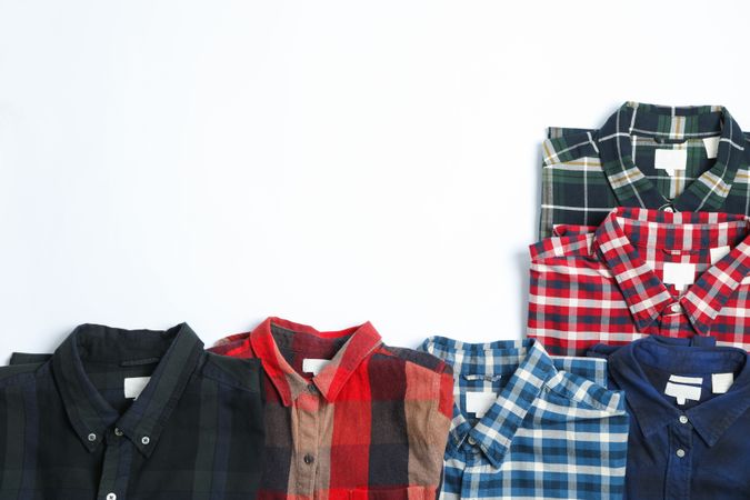 Flat lay with different shirts on blank background, copy space