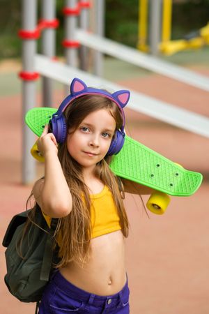 Girl Walking with Skateboard