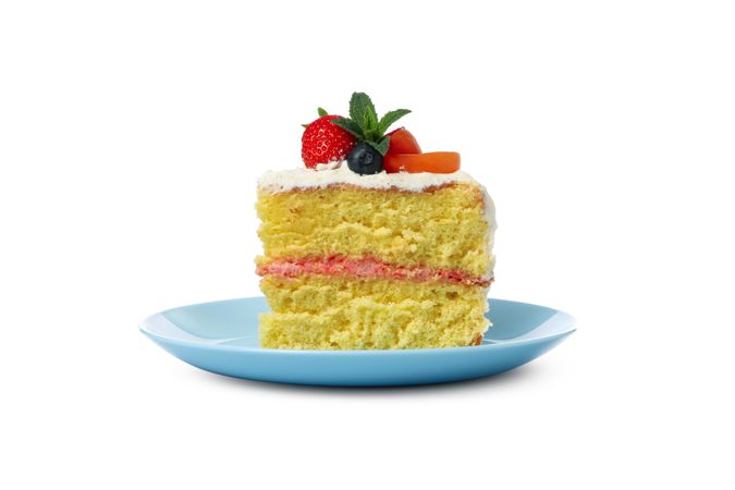 Plate with berry cream cake isolated on plain background
