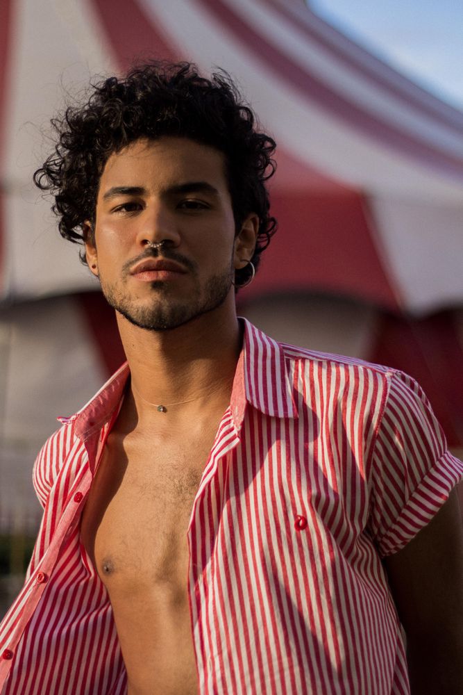 Man in red striped button up shirt outdoor