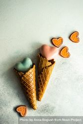 Two ceramic hearts in waffle cones on grey background sugar cookies and space for text 4BaaRe