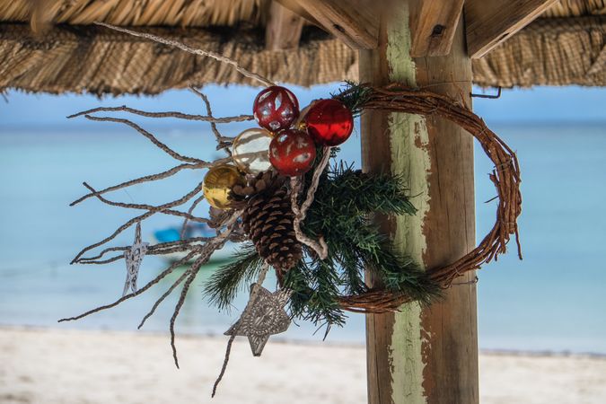 Minimal Christmas wreath hanging on a beach shack