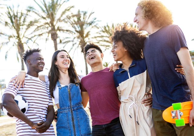 Multiracial friends standing together enjoying summertime on holidays