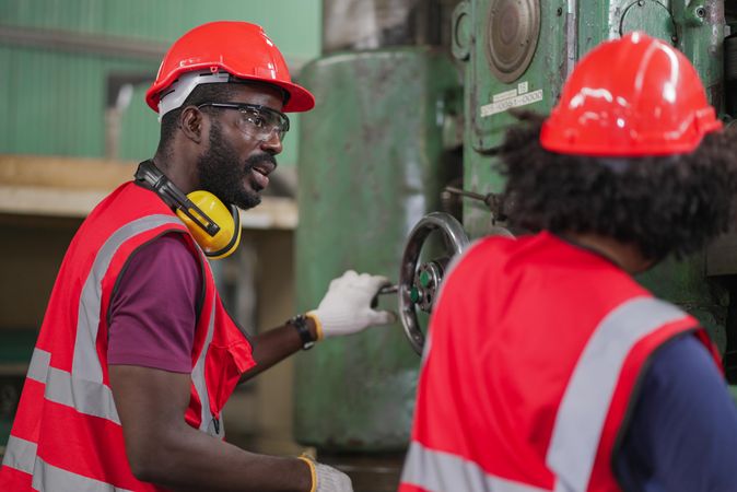 Two Black colleagues in factory