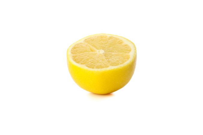 Fresh lemon isolated on light background. Ripe fruit