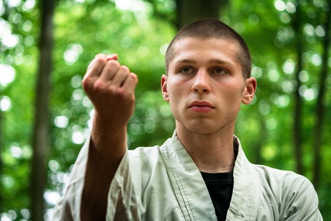 woman practicing martial arts in garden