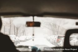 Interior shot of car while person driving on snow covered road 0yOPG4