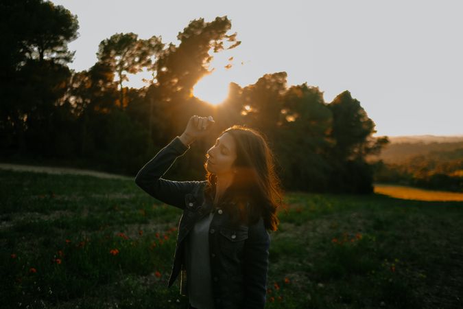 Woman walking on meadow and enjoying freedom