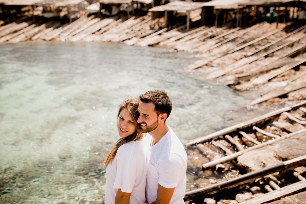 Happy lovers cuddling at cove