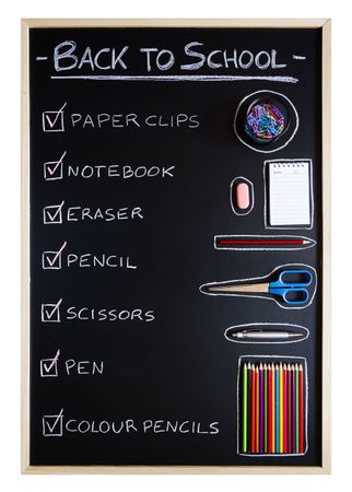 School supplies over chalkboard background
